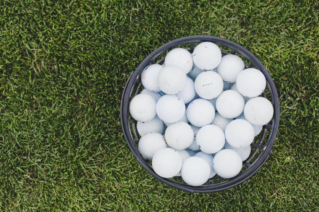 basket of golf balls from golf ball retriever for water telescopic